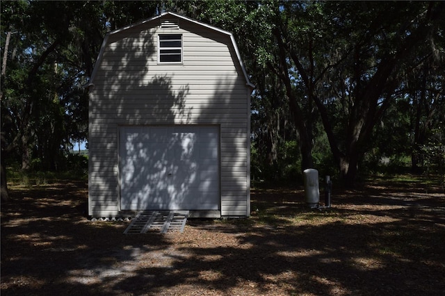garage featuring a shed