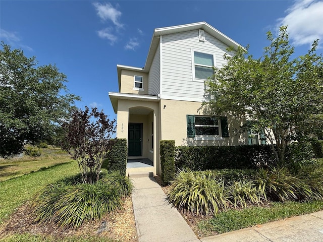 320 Primrose Dr, Davenport, FL 33837 - traditional-style home featuring stucco siding