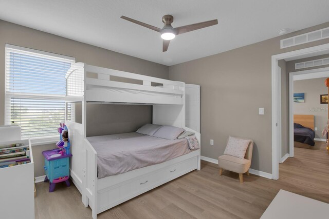 320 Primrose Dr, Davenport, FL 33837 - bedroom featuring light wood-style floors, baseboards, and ceiling fan
