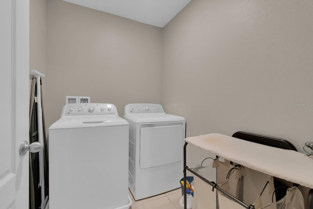 320 Primrose Dr, Davenport, FL 33837 - clothes washing area with independent washer and dryer and light tile patterned floors