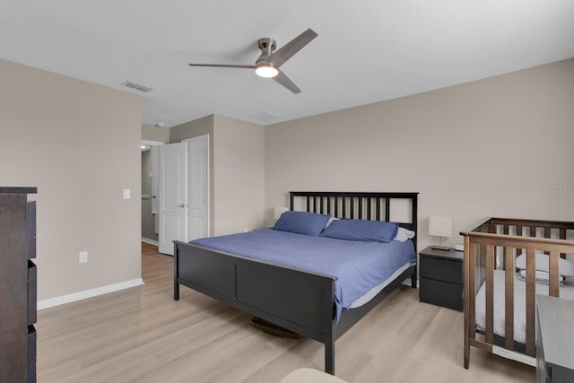 320 Primrose Dr, Davenport, FL 33837 - bedroom with light wood-type flooring, baseboards, and ceiling fan
