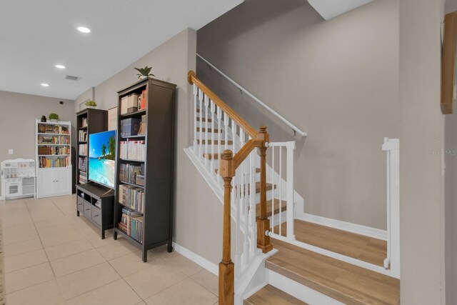 320 Primrose Dr, Davenport, FL 33837 - staircase with recessed lighting, baseboards, and tile patterned floors