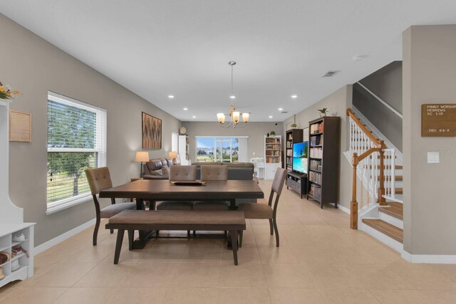 320 Primrose Dr, Davenport, FL 33837 - dining area with stairway, a chandelier, healthy amount of natural light, baseboards, and recessed lighting