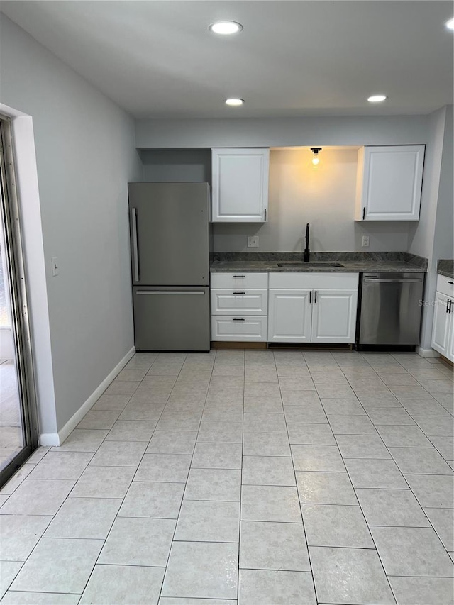 261 Deleon Rd, Debary, FL 32713 - kitchen featuring stainless steel appliances, recessed lighting, white cabinets, and a sink