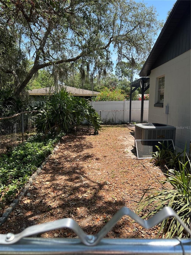 261 Deleon Rd, Debary, FL 32713 - view of yard featuring cooling unit and a fenced backyard