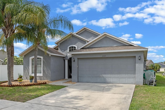 2407 Oakington St, Winter Garden, FL 34787 - single story home with stucco siding, concrete driveway, and a garage