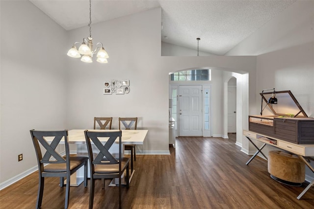 2407 Oakington St, Winter Garden, FL 34787 - dining room with arched walkways, wood finished floors, lofted ceiling, baseboards, and a chandelier