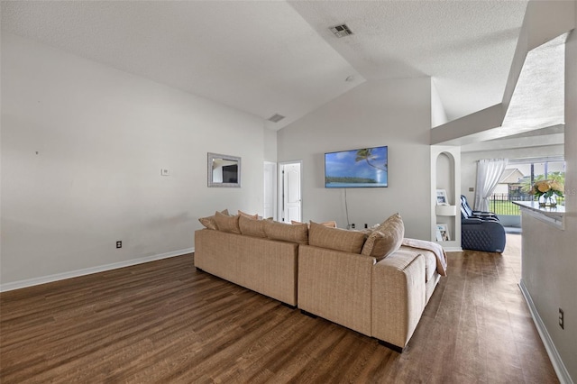 2407 Oakington St, Winter Garden, FL 34787 - living area featuring dark wood-style flooring, baseboards, high vaulted ceiling, a textured ceiling, and arched walkways