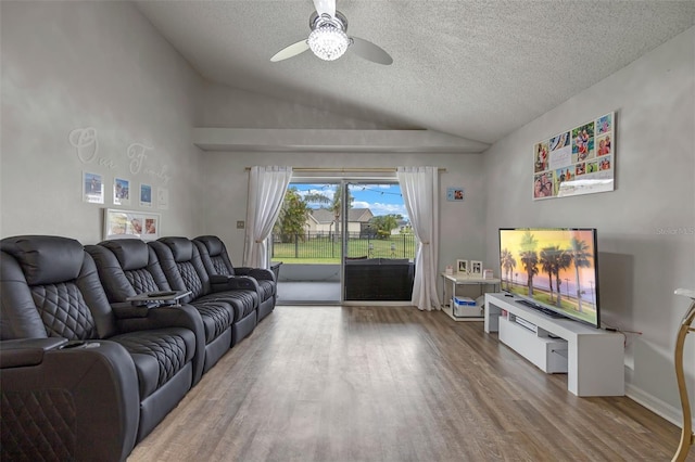 2407 Oakington St, Winter Garden, FL 34787 - living area featuring vaulted ceiling, wood finished floors, a textured ceiling, and a ceiling fan