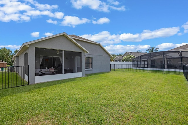 2407 Oakington St, Winter Garden, FL 34787 - back of house featuring stucco siding and a sunroom