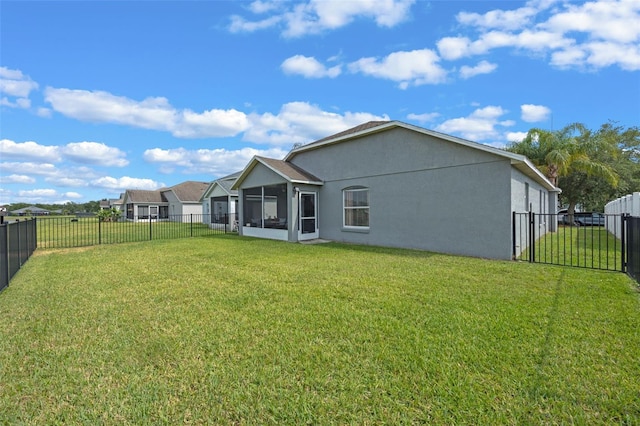 2407 Oakington St, Winter Garden, FL 34787 - rear view of house featuring a sunroom and stucco siding