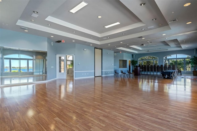 2407 Oakington St, Winter Garden, FL 34787 - exercise area featuring a raised ceiling, wood finished floors, recessed lighting, baseboards, and a high ceiling