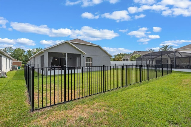 2407 Oakington St, Winter Garden, FL 34787 - back of house featuring a sunroom and stucco siding