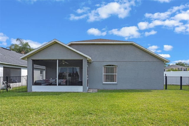 2407 Oakington St, Winter Garden, FL 34787 - back of property featuring a sunroom, a ceiling fan, and stucco siding