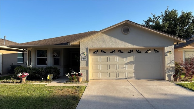 ranch-style home featuring a front yard, central AC unit, stucco siding, driveway, and an attached garage