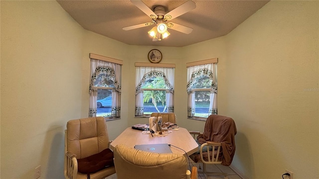 tiled office space with ceiling fan