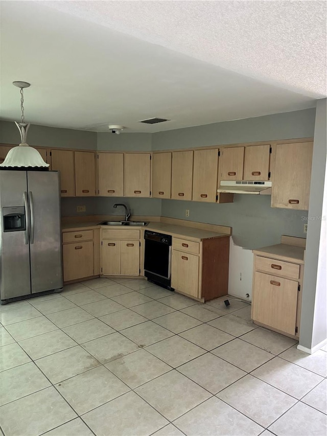 kitchen featuring light brown cabinets, stainless steel fridge, under cabinet range hood, black dishwasher, and a sink