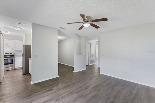 unfurnished living room featuring visible vents, a ceiling fan, baseboards, and dark wood-style floors