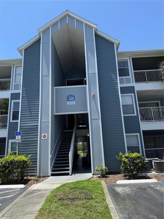 2516 Grassy Point Dr Unit 210, Lake Mary, FL 32746 - view of building exterior featuring central air condition unit