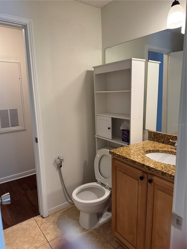 2516 Grassy Point Dr Unit 210, Lake Mary, FL 32746 - bathroom with tile patterned floors, vanity, baseboards, and toilet