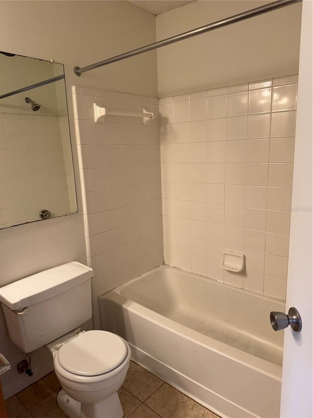 2516 Grassy Point Dr Unit 210, Lake Mary, FL 32746 - bathroom featuring tile patterned flooring, toilet, and shower / washtub combination