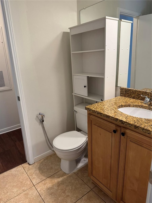 2516 Grassy Point Dr Unit 210, Lake Mary, FL 32746 - bathroom with toilet, vanity, tile patterned flooring, and baseboards