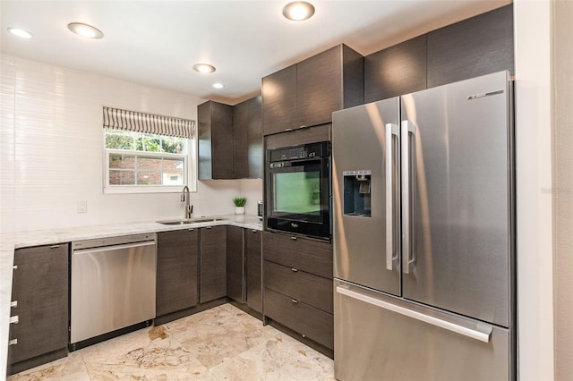 4332 Lake Underhill Rd Unit 12D10, Orlando, FL 32803 - kitchen with stainless steel appliances, dark brown cabinetry, a sink, and marble finish floor