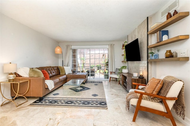 4332 Lake Underhill Rd Unit 12D10, Orlando, FL 32803 - living room featuring marble finish floor and visible vents