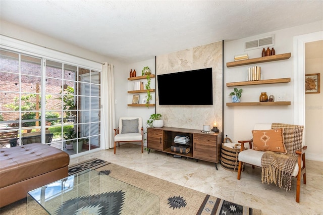 4332 Lake Underhill Rd Unit 12D10, Orlando, FL 32803 - living room featuring visible vents