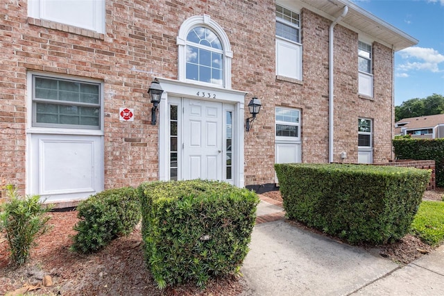4332 Lake Underhill Rd Unit 12D10, Orlando, FL 32803 - view of exterior entry with brick siding