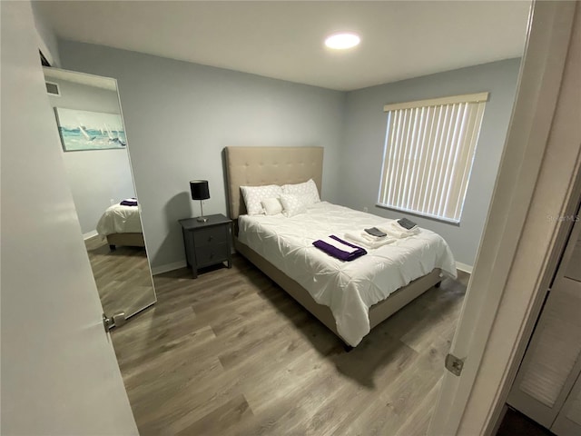 3147 Britannia Blvd Unit A, Kissimmee, FL 34747 - bedroom featuring baseboards, wood finished floors, and visible vents