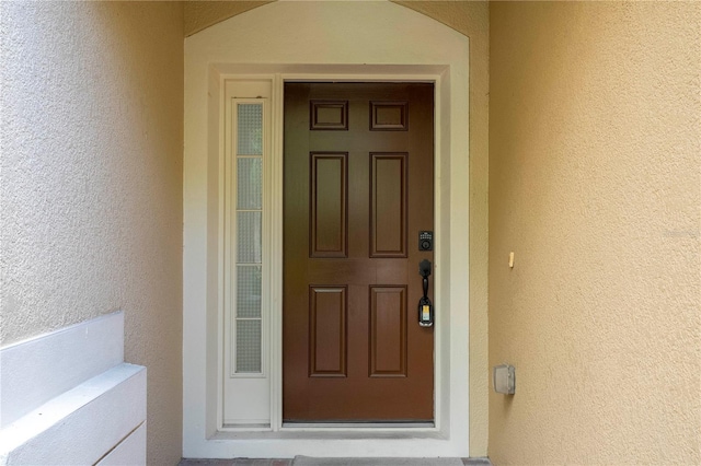 3567 Shallot Dr Unit 103, Orlando, FL 32835 - doorway to property featuring stucco siding