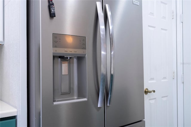 3567 Shallot Dr Unit 103, Orlando, FL 32835 - detailed view of stainless steel refrigerator with ice dispenser