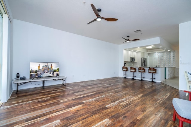 3567 Shallot Dr Unit 103, Orlando, FL 32835 - living room with ceiling fan and wood finished floors
