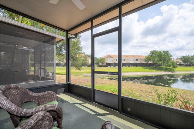 3567 Shallot Dr Unit 103, Orlando, FL 32835 - sunroom / solarium with a ceiling fan and a water view