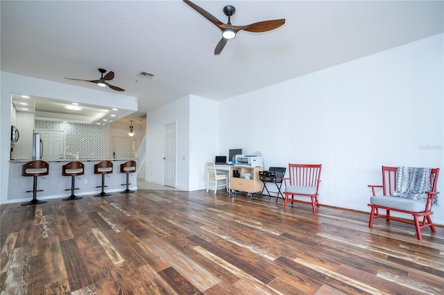 3567 Shallot Dr Unit 103, Orlando, FL 32835 - living area with a ceiling fan, wood finished floors, and a tray ceiling