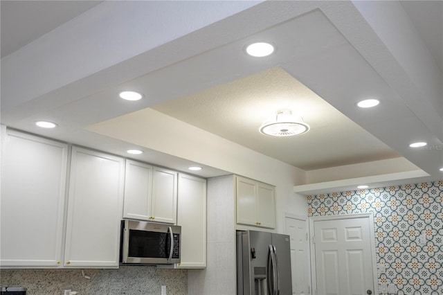 3567 Shallot Dr Unit 103, Orlando, FL 32835 - kitchen with appliances with stainless steel finishes and recessed lighting