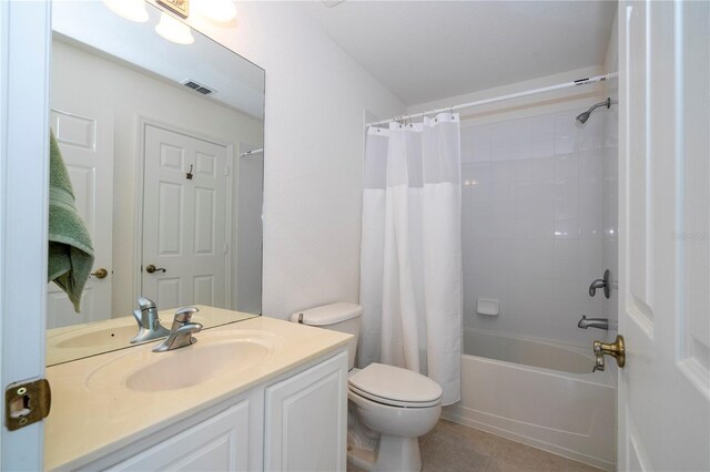 3567 Shallot Dr Unit 103, Orlando, FL 32835 - full bathroom with toilet, vanity, shower / bath combo with shower curtain, and tile patterned flooring