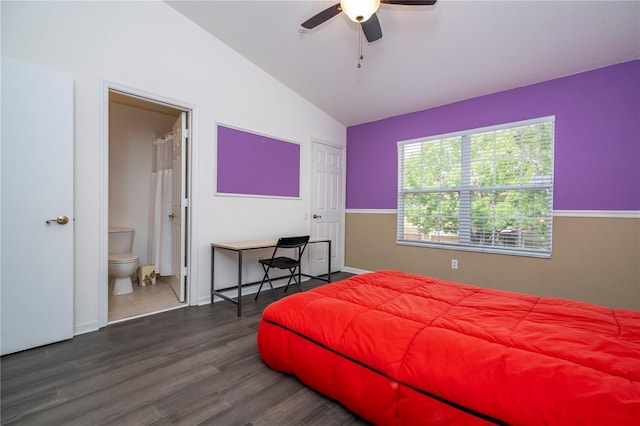 3567 Shallot Dr Unit 103, Orlando, FL 32835 - bedroom with vaulted ceiling, dark wood-style floors, connected bathroom, baseboards, and a ceiling fan