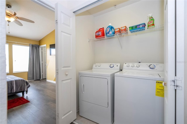 3567 Shallot Dr Unit 103, Orlando, FL 32835 - laundry area with washing machine and dryer, a ceiling fan, and light wood-style flooring