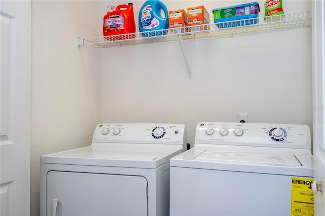 3567 Shallot Dr Unit 103, Orlando, FL 32835 - clothes washing area with washer and clothes dryer