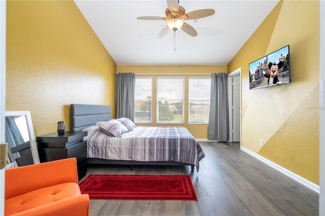3567 Shallot Dr Unit 103, Orlando, FL 32835 - bedroom featuring lofted ceiling, a textured wall, wood finished floors, baseboards, and a ceiling fan