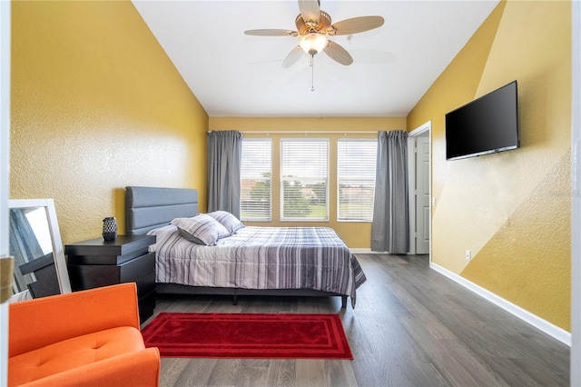 3567 Shallot Dr Unit 103, Orlando, FL 32835 - bedroom featuring vaulted ceiling, a textured wall, wood finished floors, baseboards, and a ceiling fan