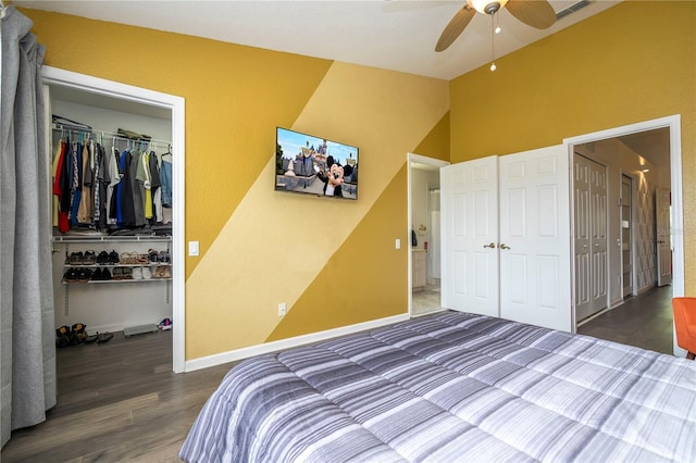 3567 Shallot Dr Unit 103, Orlando, FL 32835 - bedroom featuring a closet, a walk in closet, wood finished floors, ceiling fan, and baseboards