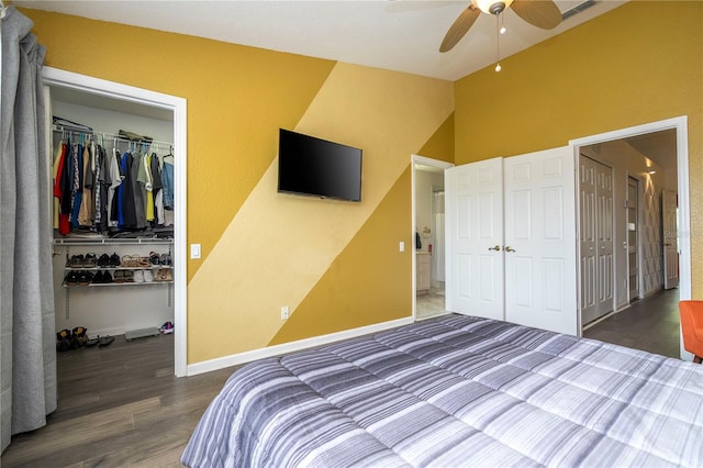 3567 Shallot Dr Unit 103, Orlando, FL 32835 - bedroom with a closet, a walk in closet, wood finished floors, ceiling fan, and baseboards