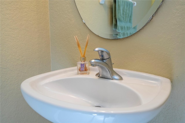 3567 Shallot Dr Unit 103, Orlando, FL 32835 - bathroom view of a textured wall and a sink