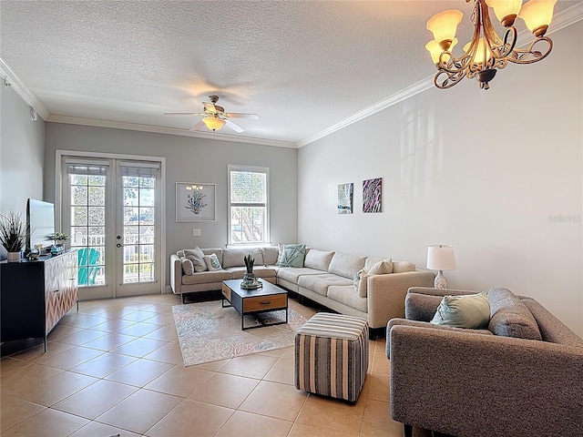 7509 Mourning Dove Cir Unit 203, Reunion, FL 34747 - living room featuring french doors, a textured ceiling, light tile patterned floors, ceiling fan with notable chandelier, and ornamental molding