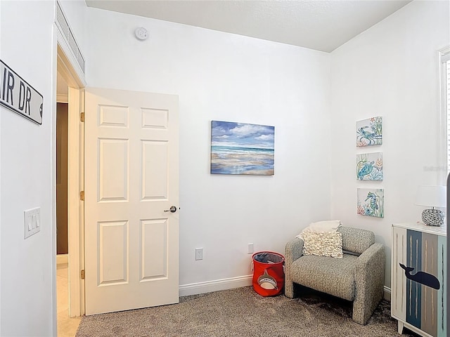 7509 Mourning Dove Cir Unit 203, Reunion, FL 34747 - living area featuring baseboards and light carpet