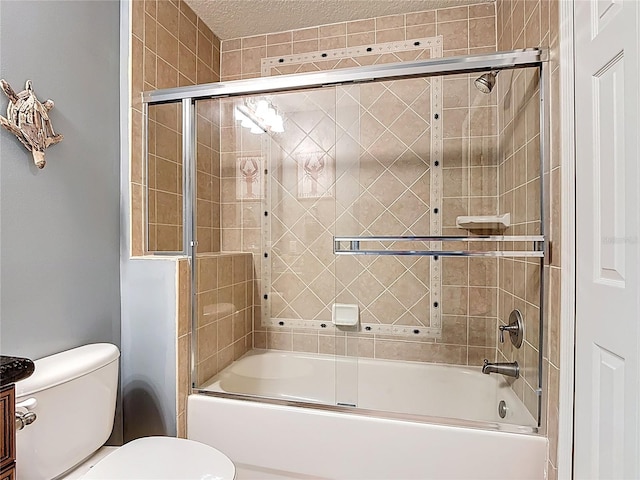 7509 Mourning Dove Cir Unit 203, Reunion, FL 34747 - bathroom with toilet, a textured ceiling, and enclosed tub / shower combo