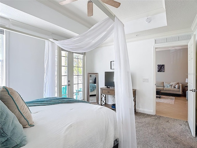 7509 Mourning Dove Cir Unit 203, Reunion, FL 34747 - bedroom featuring ceiling fan, a textured ceiling, access to exterior, crown molding, and carpet floors